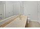 Bathroom featuring tiled flooring, a large mirror, and a single sink at 11134 Westoves Dr, Noblesville, IN 46060