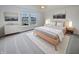 Cozy bedroom with modern furnishings, soft carpeting, neutral decor, and bright natural light at 11134 Westoves Dr, Noblesville, IN 46060