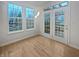 Sun-drenched breakfast area with hardwood floors and double doors leading to the back deck at 11134 Westoves Dr, Noblesville, IN 46060