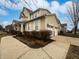 Exterior view showcasing the home's facade, including a two-car garage and landscaped surroundings at 11134 Westoves Dr, Noblesville, IN 46060
