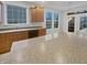 Bright kitchen featuring oak cabinets, solid surface countertops, and natural light at 11134 Westoves Dr, Noblesville, IN 46060
