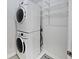 Efficient laundry room with stacked washer and dryer, and convenient wire shelving at 11134 Westoves Dr, Noblesville, IN 46060