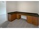 Office space with built-in wooden cabinets and dark countertop, carpeted floor, and neutral walls at 11134 Westoves Dr, Noblesville, IN 46060