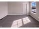 Well-lit bedroom with a large window, neutral walls, and plush carpet at 1155 Dark Star Ct, Whiteland, IN 46184