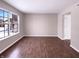 Bright living room with hardwood floors, a large window, and neutral color palette at 1155 Dark Star Ct, Whiteland, IN 46184