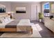 Cozy bedroom with a large window, soft carpet, and a comfortable bed at 1155 Dark Star Ct, Whiteland, IN 46184