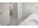 Bright bathroom featuring double sinks, tile floor, and a separate toilet at 12036 Weathered Edge Dr, Fishers, IN 46037