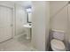 Bathroom featuring white fixtures, a pedestal sink, and tile flooring at 12036 Weathered Edge Dr, Fishers, IN 46037