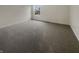 Bedroom with neutral carpet, a window, and outlets visible on the wall at 12036 Weathered Edge Dr, Fishers, IN 46037