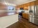 Bright kitchen featuring stainless steel appliances, wood cabinets, and an island at 12036 Weathered Edge Dr, Fishers, IN 46037