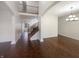 Bright living room featuring hardwood floors, stairs to upper level, and neutral paint at 12036 Weathered Edge Dr, Fishers, IN 46037