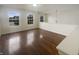 Bright living room with hardwood floors, large windows and neutral paint at 12036 Weathered Edge Dr, Fishers, IN 46037
