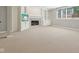 Basement living area featuring a fireplace, built in shelving and plenty of natural light at 13133 Brooks Landing Pl, Carmel, IN 46033