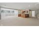 Spacious basement featuring a dry bar and a bank of windows that provide natural light at 13133 Brooks Landing Pl, Carmel, IN 46033