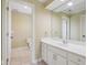 Well-lit bathroom with a long vanity with a large mirror, providing functionality and style for daily routines at 13133 Brooks Landing Pl, Carmel, IN 46033