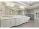 Bathroom with white cabinets, a large mirror and modern chandelier at 13133 Brooks Landing Pl, Carmel, IN 46033
