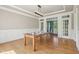 Bright dining room featuring hardwood floors, and open view to other parts of the house at 13133 Brooks Landing Pl, Carmel, IN 46033