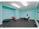 Bright workout room boasting ample space, rubber flooring, and modern exercise equipment at 13133 Brooks Landing Pl, Carmel, IN 46033