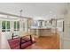 Bright kitchen with island, stainless appliances, and adjacent dining area with table at 13133 Brooks Landing Pl, Carmel, IN 46033