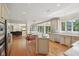 Spacious open kitchen with an island, stainless steel appliances, and hardwood floors at 13133 Brooks Landing Pl, Carmel, IN 46033
