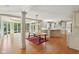 Bright open kitchen with island and dining area featuring natural light and hardwood floors at 13133 Brooks Landing Pl, Carmel, IN 46033