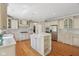 Bright and open kitchen featuring custom cabinetry, stainless steel appliances, and a center island at 13133 Brooks Landing Pl, Carmel, IN 46033
