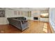 Inviting living room with fireplace, built-ins, and a large sectional sofa at 13133 Brooks Landing Pl, Carmel, IN 46033