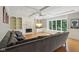 Comfortable living room with fireplace, built-in shelving, and large window at 13133 Brooks Landing Pl, Carmel, IN 46033