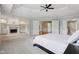 Large main bedroom boasts a fireplace, built-in bookcases, and an open doorway at 13133 Brooks Landing Pl, Carmel, IN 46033