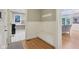 Functional mudroom with built-in bench seating, coat hooks, and easy access to the laundry room and living area at 13133 Brooks Landing Pl, Carmel, IN 46033