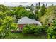 Aerial view of property highlighting mature trees and lush greenery surrounding the brick home at 1320 N New Jersey St, Indianapolis, IN 46202