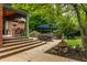 Beautiful backyard with an outdoor kitchen and fountain beyond the covered patio at 1320 N New Jersey St, Indianapolis, IN 46202