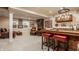 Basement area with bar top, seating, and a brick fireplace at 1320 N New Jersey St, Indianapolis, IN 46202