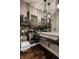 Modern half bathroom featuring dark wood floors, a vessel sink, and a skyline mural at 1320 N New Jersey St, Indianapolis, IN 46202