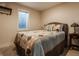 Cozy bedroom with neutral colors, a soft bed, and a large window at 1320 N New Jersey St, Indianapolis, IN 46202