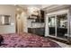 Bedroom with a wet bar and sliding glass doors leading to an outdoor lounge at 1320 N New Jersey St, Indianapolis, IN 46202