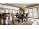 Elegant dining room with hardwood floors, modern chandelier, and sliding glass doors for natural light at 1320 N New Jersey St, Indianapolis, IN 46202
