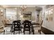 Open-concept dining room with decorative chandelier, sleek built-ins and seamless flow to the living area at 1320 N New Jersey St, Indianapolis, IN 46202