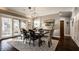 Light-filled dining room with glass doors, modern art, and seamless access to the outdoor patio at 1320 N New Jersey St, Indianapolis, IN 46202