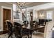 Dining room with hardwood floors, staircase, black piano, and natural light creates a welcoming atmosphere at 1320 N New Jersey St, Indianapolis, IN 46202