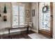 Charming entryway featuring a wooden bench, plantation shutters, and a glimpse of the inviting porch swing at 1320 N New Jersey St, Indianapolis, IN 46202