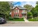 Charming brick home with a welcoming porch and well-maintained front yard at 1320 N New Jersey St, Indianapolis, IN 46202