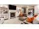 Open living room features a cozy fireplace, custom built-ins, and seamless dining area at 1320 N New Jersey St, Indianapolis, IN 46202