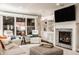 Inviting living room featuring a cozy fireplace, bright windows, and comfortable seating at 1320 N New Jersey St, Indianapolis, IN 46202