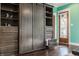 Wardrobe featuring barn door access, custom shelving and drawers, in the main bedroom at 1320 N New Jersey St, Indianapolis, IN 46202