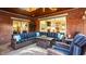 Stylish outdoor patio with brick walls, comfortable sectional seating, and a decorative ceiling fan at 1320 N New Jersey St, Indianapolis, IN 46202