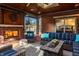Cozy outdoor living space boasts a brick fireplace, comfortable seating, and charming decor at 1320 N New Jersey St, Indianapolis, IN 46202