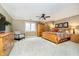Spacious bedroom with a ceiling fan, natural light, carpeted floor, and neutral walls at 13661 Smokey Ridge Pl, Carmel, IN 46033