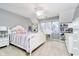 A nicely decorated bedroom with a ceiling fan, a window desk, and built-in shelving at 13661 Smokey Ridge Pl, Carmel, IN 46033