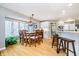 Bright dining area featuring hardwood floors and ample natural light at 13661 Smokey Ridge Pl, Carmel, IN 46033